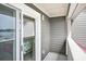 Private balcony showcasing harbor views from the bedroom at 74 Mariners Cay Dr, Folly Beach, SC 29439