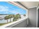 Balcony view of palm trees and a tranquil harbor at 74 Mariners Cay Dr, Folly Beach, SC 29439