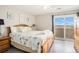 Comfortable bedroom with ensuite bathroom and balcony access at 74 Mariners Cay Dr, Folly Beach, SC 29439
