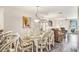 Welcoming dining room with seating for six and a view into the living room at 74 Mariners Cay Dr, Folly Beach, SC 29439
