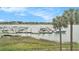 Beautiful view of the marina from a condo window, framed by palm trees at 74 Mariners Cay Dr, Folly Beach, SC 29439