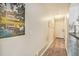 Clean condo hallway with wood-look flooring and white accents at 74 Mariners Cay Dr, Folly Beach, SC 29439