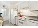 Well-lit kitchen with essential appliances and ample cabinet space for storage at 74 Mariners Cay Dr, Folly Beach, SC 29439