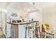 Functional kitchen with white cabinets and bar seating, great for casual dining at 74 Mariners Cay Dr, Folly Beach, SC 29439