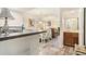 Open floor plan from kitchen through dining to the living room providing an airy feel at 74 Mariners Cay Dr, Folly Beach, SC 29439