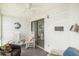 Bright sunroom includes rocking chairs and water view at 74 Mariners Cay Dr, Folly Beach, SC 29439