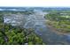 Expansive aerial view of waterfront property surrounded by marshland and waterways, offering serene and picturesque views at 8374 Chisolm Plantation Rd, Edisto Island, SC 29438