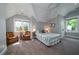 Spacious bedroom with vaulted ceiling, comfortable bed and lots of natural light at 8374 Chisolm Plantation Rd, Edisto Island, SC 29438
