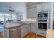 The kitchen has stainless steel appliances, gray cabinets and counter-space at 8374 Chisolm Plantation Rd, Edisto Island, SC 29438