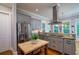 Updated kitchen with stainless steel appliances, granite countertops, and a stylish range hood at 8374 Chisolm Plantation Rd, Edisto Island, SC 29438