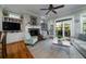 The living room features a fireplace, hardwood floors, and large windows with a view at 8374 Chisolm Plantation Rd, Edisto Island, SC 29438