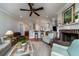 Open living room features hardwood floors, a fireplace, and seating at 8374 Chisolm Plantation Rd, Edisto Island, SC 29438