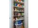 Walk-in pantry features fully stocked shelves for storage at 8374 Chisolm Plantation Rd, Edisto Island, SC 29438