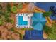 Aerial view of community pool area including lounge chairs, tables, cabana and parking spaces at 8409 Hidden Bakers Trce, North Charleston, SC 29418