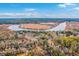 Aerial view showcasing a community surrounded by lakes and lush landscape at 8409 Hidden Bakers Trce, North Charleston, SC 29418