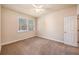 Inviting bedroom with plush carpet, neutral walls, and a window that offers natural light and outdoor views at 8409 Hidden Bakers Trce, North Charleston, SC 29418
