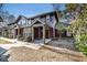 Attractive townhome with a covered entryway, showcasing craftsman-style details and a well-kept front yard at 8409 Hidden Bakers Trce, North Charleston, SC 29418