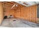 Spacious garage with wooden framing and ample room for parking and storage solutions at 8409 Hidden Bakers Trce, North Charleston, SC 29418