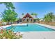 Community pool and outdoor kitchen with ample space for relaxation and entertainment at 8409 Hidden Bakers Trce, North Charleston, SC 29418