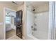 En Suite bath showcases the doorway to the bed, tub and shower combo, and vanity at 9707 Seed St, Ladson, SC 29456