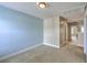 Bedroom with blue accent wall, neutral walls, carpet, and a window with blinds for natural light at 9707 Seed St, Ladson, SC 29456