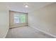 Bedroom with neutral walls, carpet, and a window with blinds for natural light at 9707 Seed St, Ladson, SC 29456