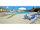 Inviting community pool featuring Gathering-friendly splash pad, sun umbrellas, and ample seating at 9707 Seed St, Ladson, SC 29456