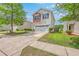 Charming two-story home with a white exterior, red accents, and a well-manicured lawn in a suburban neighborhood at 9707 Seed St, Ladson, SC 29456