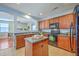 Well-equipped kitchen featuring wooden cabinetry, island, and modern appliances, perfect for cooking at 9707 Seed St, Ladson, SC 29456