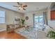 Cozy living room featuring a ceiling fan, sliding glass doors, and stylish furniture arrangement at 9707 Seed St, Ladson, SC 29456