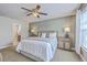 Serene main bedroom with a ceiling fan, a comfortable bed, and modern decor at 9707 Seed St, Ladson, SC 29456