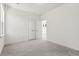 Carpeted bedroom features white walls, baseboards, and a double-door closet for ample storage space at 100 Hawthorne Landing Dr, Goose Creek, SC 29445