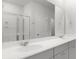Bathroom featuring double sinks, a large mirror, and a glass-enclosed shower at 1023 Swamp Rose Run, Summerville, SC 29485