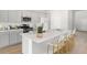 Modern kitchen featuring an island with bar seating, stainless steel appliances, and ample cabinet space at 1023 Swamp Rose Run, Summerville, SC 29485