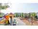 Colorful community playground featuring slides, climbing structures, and playhouses in a Gathering-friendly setting at 1023 Swamp Rose Run, Summerville, SC 29485