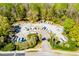 Aerial view of boat storage area with boats, palm trees, forest, RVs, and a circular driveway at 1025 Riverland Woods Pl # 106, Charleston, SC 29412