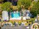 Overhead view of a community pool and clubhouse nestled in a vibrant, green landscape at 1025 Riverland Woods Pl # 106, Charleston, SC 29412