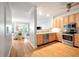Open kitchen with stainless appliances, hardwood floors and plenty of cabinet space at 1025 Riverland Woods Pl # 106, Charleston, SC 29412