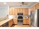 Kitchen with stainless steel appliances, light wood cabinets and plenty of counter space at 1025 Riverland Woods Pl # 106, Charleston, SC 29412