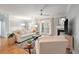 Spacious living area boasts comfortable seating, fireplace, and access to a balcony at 1025 Riverland Woods Pl # 106, Charleston, SC 29412