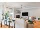 The living room provides comfortable seating, fireplace, and hardwood floors at 1025 Riverland Woods Pl # 106, Charleston, SC 29412