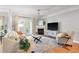 Cozy living room features a fireplace, hardwood floors, ceiling fan, and a seating area at 1025 Riverland Woods Pl # 106, Charleston, SC 29412