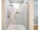 Modern tiled shower with a glass door, rainfall shower head, and built-in niche at 1025 Riverland Woods Pl # 106, Charleston, SC 29412