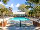 Relaxing pool area featuring plenty of seating and clubhouse with nice covered patio at 1025 Riverland Woods Pl # 106, Charleston, SC 29412
