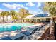 Community pool deck area with ample seating for residents to enjoy in the sun at 1025 Riverland Woods Pl # 106, Charleston, SC 29412