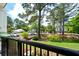Scenic view from the porch overlooking mature trees, landscaping and street at 1025 Riverland Woods Pl # 106, Charleston, SC 29412