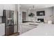 Open concept kitchen with stainless steel appliances and a view into the connected living room at 1032 Scotch Bonnet Way, Summerville, SC 29485