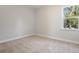 Bright bedroom featuring neutral carpeting, a window with backyard views and freshly painted walls at 104 Hawthorne Landing Dr, Goose Creek, SC 29445
