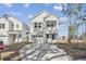 Charming two-story home with white siding, a two-car garage, and manicured landscaping at 104 Hawthorne Landing Dr, Goose Creek, SC 29445