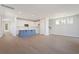 Bright living room featuring hardwood flooring, a kitchen island, and views into the kitchen and dining at 104 Hawthorne Landing Dr, Goose Creek, SC 29445
